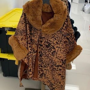 Stylist coverlet can be worn over leather jacket